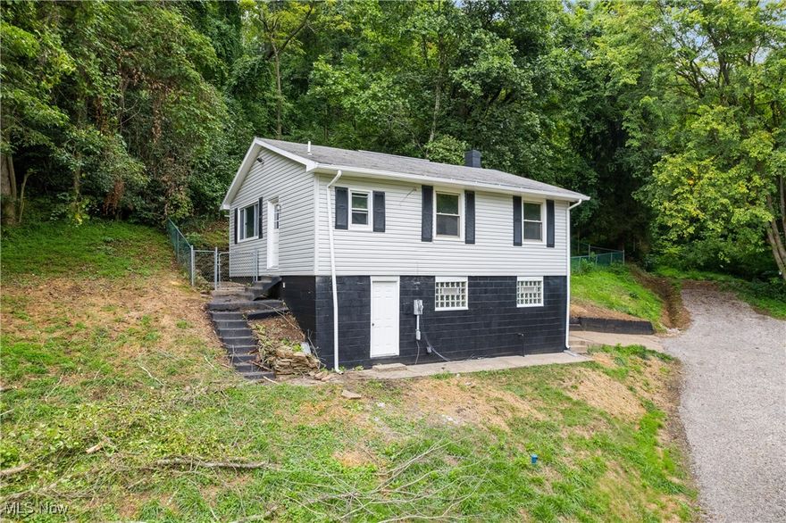 Welcome to 25 Willetta Ave, a beautifully updated home in the heart of Martins Ferry, Ohio! This charming residence offers modern amenities and stylish finishes that make it a perfect choice for your next home. Key Features: Completely Updated Kitchen: Enjoy cooking in your brand-new kitchen featuring sleek stainless steel appliances, custom cabinetry, and elegant countertops. Spacious Bathrooms: This home boasts 2 and a half baths, all updated with contemporary fixtures and finishes for your comfort and convenience. New Flooring Throughout: Experience the beauty and durability of the newly installed flooring that flows seamlessly through every room. Electric Fireplace: Cozy up in the living room by the electric fireplace, adding warmth and ambiance to your evenings. Fenced-In Yard: The backyard is fully fenced, offering privacy and a safe space.  Privacy: This home provides the tranquility and privacy you desire. Don't miss out on the opportunity to own this stunning home at 25 Willetta Ave. Schedule a showing today and see for yourself all the wonderful features it has to offer!