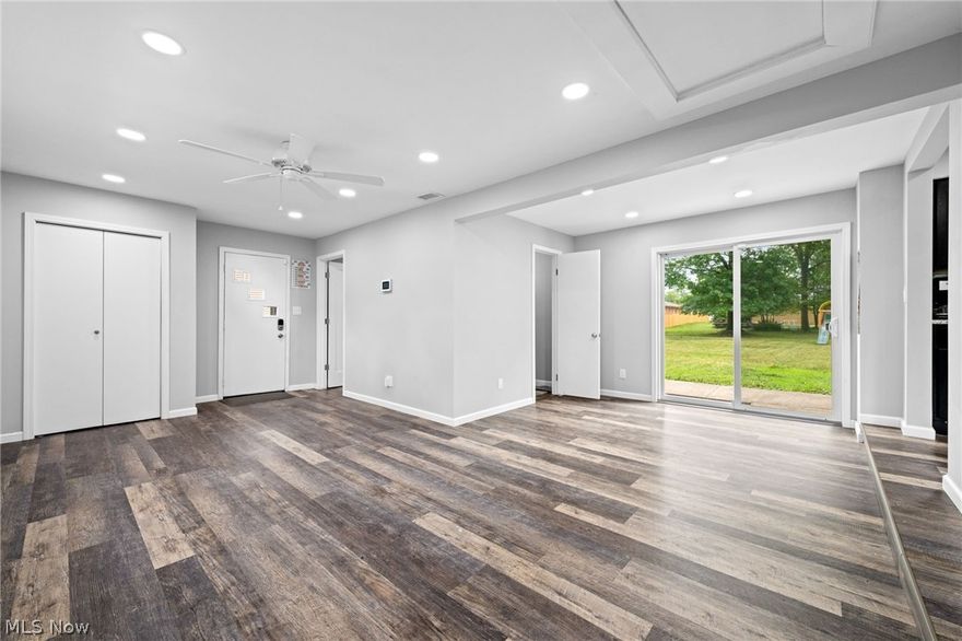 Experience the pinnacle of first-floor living in this exquisite 3-bedroom home with an open and flowing layout. As you approach, you'll be captivated by the inviting curb appeal that welcomes you inside to a spacious, light-filled living room featuring a stunning stone woodburning fireplace—a perfect centerpiece for cozy evenings. Step into the warm and welcoming family room, which provides easy access to the rear patio, ideal for both entertaining and quiet relaxation. The modern kitchen, designed for culinary delight, boasts sleek dark cabinetry, gleaming granite countertops, a stylish backsplash, and stainless-steel appliances—all included to elevate your cooking experience. Host unforgettable dinners in the elegant formal dining room, which opens up to a charming three-season sunroom, offering an idyllic spot to enjoy your morning coffee or an afternoon read. The home’s three generously sized bedrooms provide ample closet space, ensuring comfort and convenience, while two full bathrooms and a dedicated laundry room complete the thoughtful layout. Unwind on the serene rear patio or indulge in some gardening in the spacious, partially fenced-in backyard. The property also includes a detached two-car garage, providing plenty of storage and parking options. Recent updates include a new electrical box, electrical, and bathroom vent in 2022. This home blends modern amenities with timeless charm, making it a perfect retreat for those seeking comfort and style.