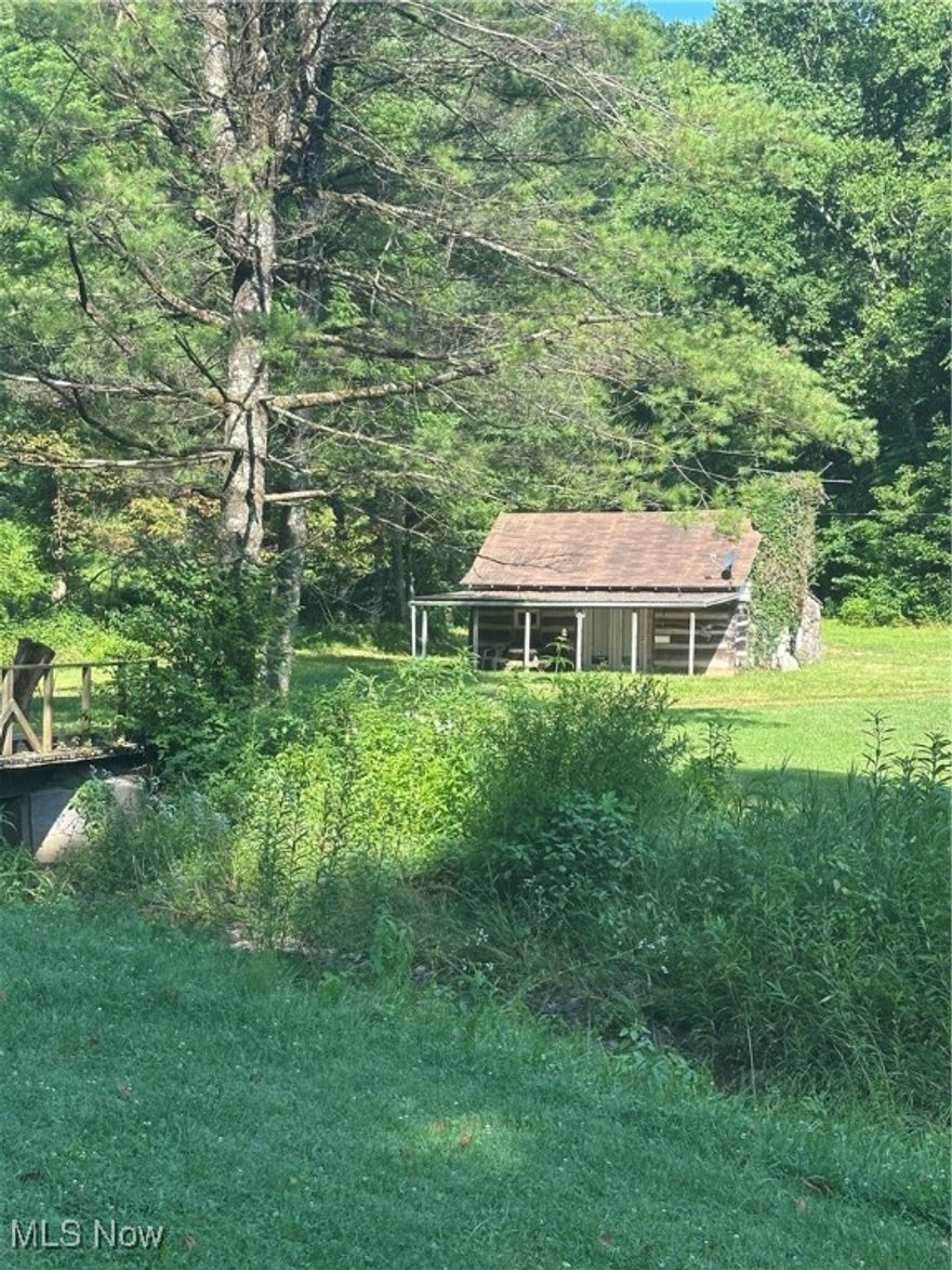 Welcome to your Private and secluded, just over one acre Cozy Log cabin on Barber Ridge road. Crossing over Town Fork Creek is your get away Log Cabin with Authentic Pioneer Oak Wood from German Design hand crafted Hewed Logs with Cement siding.  These logs were moved from Cameron Ohio.  Enter in the French doors into an open space for kitchen & living, along with a bathroom and bedroom on the main floor with an upstairs loft for additional space.  Property has its own water well and Private Septic.  Electric from South Central. With a little TLC, make this property your weekend get away with Family and Friends.   Property is just approximately 5 minutes from the Village of Woodsfield.   Schedule your appointment today.