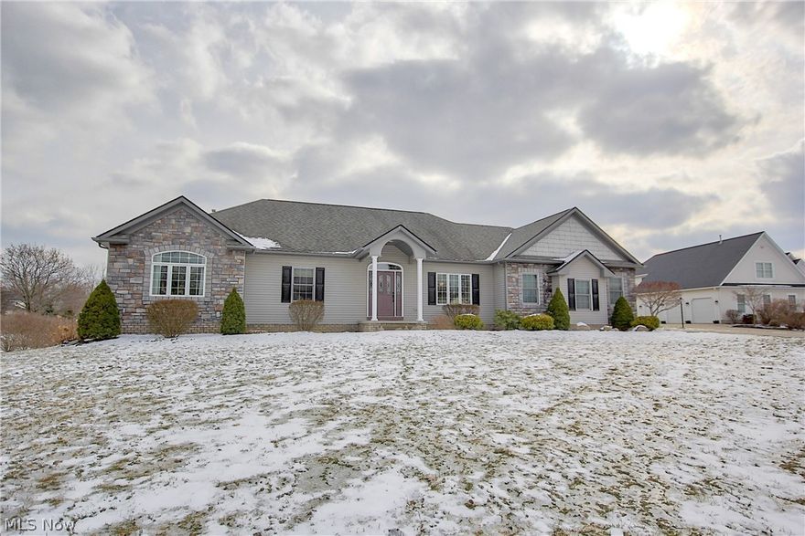 Welcome to this fabulous ranch located on a dead-end street in Portage Commons!
This home offers a family room with stone fireplace & custom built-ins, fully applianced eat-in kitchen, dining room with tray ceiling, a powder room for guests and first floor laundry. The master retreat has a large picture window, tray ceiling, private bathroom with soaker tub and a spacious walk-in closet. Two additional bedrooms and an updated bathroom complete this level.
The walk-out lower level adds 1200 additional square feet of living space - including a rec room, wet bar area, full bathroom, and office / possible 4th bedroom.
Outside you will find an extra-wide concrete driveway leading to a 3-car garage with lofted storage area, underground pet fence, concrete patio off the lower level, and a balcony off the kitchen.
Recent updates include: kitchen appliances (2014), high efficiency furnace (2015), hot water tank (2017), hallway bathroom (2018).
This home is move-in ready on a .76 acre lot!