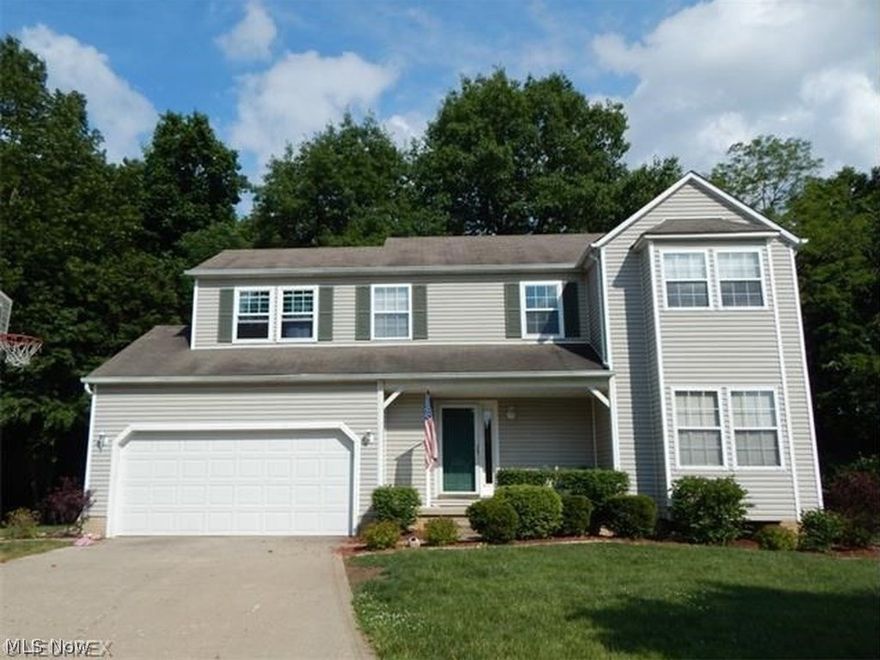 Ready Immediately! Spacious Open Floor plan Colonial-style Home with Attached 2 Car Garage and Full Unfinished Basement on a Wooded Cul-De-Sac Lot located in the city of Medina, OH! The home has 1,678 sq. ft. of above ground living space with 3 Bedrooms, 2.5 Baths. Large Eat-in Kitchen, Oak Cabinets, Appliances (New Refrigerator coming soon) Laminate Flooring and Bay Window seating area in the Dinette. The Family Room has a Woodburning Fireplace with Wood Laminate Flooring. There is a private 14'X10' Wood Deck with views of trees and nature. New Carpet on stairs and upper level. Master Bedroom with Cathedral Ceiling and Storage/Display area above has a private Bath with dual sinks, garden tub & separate shower. 2 Other Bedrooms have great closet and storage space. Upper Level Laundry Room is also provided. Covered Front Porch, Vinyl Siding and Storage Shed/Outbuilding. All appliances stay. Newer insulated garage door in 2012 & some new energy efficient windows in 2013 added. Home Warra