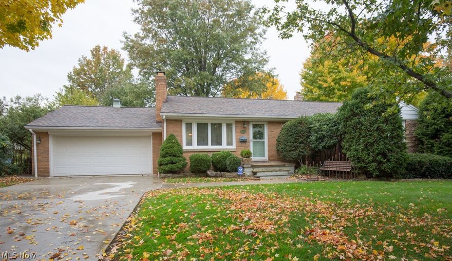 Absolutely Adorable ALL BRICK 3 Bedroom Ranch home with Stunning Hardwood Floors Throughout & Private, Scenic Backyard.  Home Features Include:  Large Open Living Room with Fireplace, Awesome Kitchen with Updated Cabinets, Countertops, & Flooring, Formal Dining Room,  3 Large Bedrooms, & Full Bath.   Lower Level offers a HUGE Rec Room with Knotty Pine Paneling, Bar Area, Wood Burning Fireplace, Laundry Room, & 2nd Full Bath.  Awesome Back Sun Room leads to the Perfectly Private & Scenic Backyard.  New Furnace - 2014, New Roof - 2014, New AC - 2014, New Drive - 2014, New Front Sidewalk - 2014, New Sun Room Windows - 2008, Updated Kitchen, Awesome Hardwood Floors, and a Fresh Coat of Paint!  Home is just Amazing!