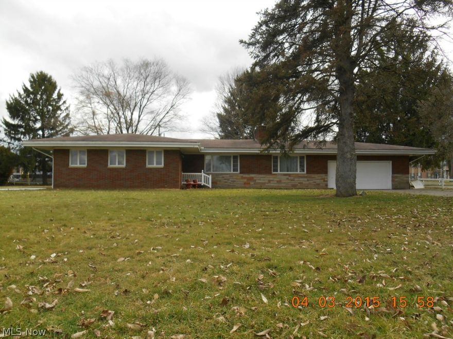 3 bedroom, 3 bath brick home with a comforting stone fireplace in the large living room, spacious partially finished basement, oversized 2 car attached garage and a large yard with vinyl fence.