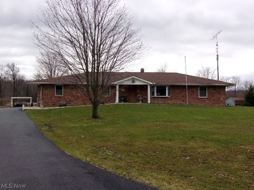 Stately custom built Brick Ranch on knoll in the country/ Minutes from Pymatuning Lake/ Nearly 2000 square feet of living space/ Lots of hardwood flooring/ Oak Kitchen & all appliances stay/ Gorgeous heated and air conditioned Sunroom overlooks the stocked pond/ Central air & Heat pump 6 yrs old/ Roof 4 yrs old/ Large paved driveway 3 yrs old/ Full 11 block high Basement/ Huge Pavilion with Kitchen & Bath/ Pagoda overlooks the pond/ Hot tub stays/ 38 x 84 Barn with water & electric/ Fruit trees/ Property being split from larger parcel