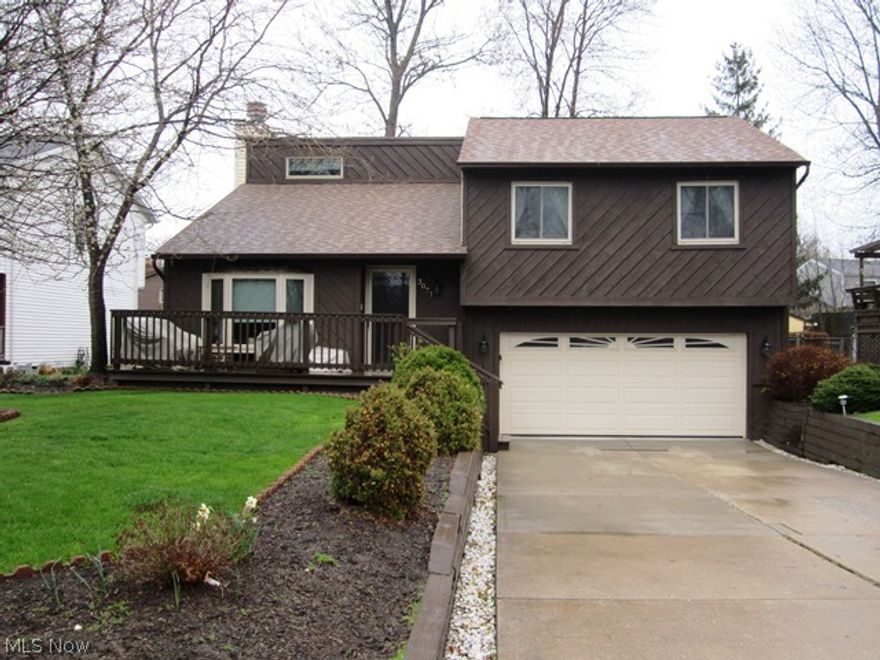 Welcome to this fantastic cedar front Bi-Level home with numerous updates throughout! Enter into the spacious living room, with high vaulted ceilings and beautiful front bay window. The kitchen offers newer stainless steel appliances and plenty of cabinet space. There are three spacious bedrooms with ample amounts of closet and storage space, including a walk-in master bedroom closet. Relax in the lower level family room with a beautiful brick fireplace. Entertain your guests on the large back deck overlooking a fenced in backyard. Backyard includes shed and large mulched play area with the newer wooden playground set for the kids! Extra deep 2 car attached garage and large attic for extra storage. Newer updated include: Roof (2005), high efficiency windows (2008), garage door (2010), front and back doors including storm door (2012), light fixtures, and paint. This home is in a great neighborhood, close to freeway, and across the street from Chagrin River Park.