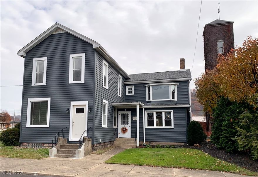Step into history with this distinguished residence, originally built in 1818 and thoughtfully expanded through the decades. Perfectly situated in the center of town, the home is surrounded by historic churches, the gazebo common area, and other notable heritage buildings, creating a picturesque and timeless setting. This remarkable property features 11 spacious rooms, 3 full baths, and 3 half baths, blending historic elegance with modern convenience. The most recent addition, completed in 1958, introduced a bright kitchen, a comfortable primary bedroom with private bath and a convenient two car garage. Recent improvements include vinyl siding, new windows and exterior doors, a new roof and more, ensuring lasting quality while preserving the home's classic charm. With its versatile layout, this property offers many possibilities- ideal for a home office, first floor in-law suite, or simply a spacious family residence. Adjacent to the World War 1 Monument-unveiled in 1919 as the earliest monument to the Great War in the United States- this prestigious historic home presents a rare opportunity to own a piece of local history in one of the town's most iconic and walkable locations. This is truly a must-see property-rich in character, filled with potential, and ready to continue its remarkable story.