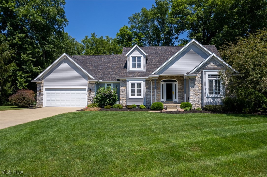 Custom built Cape Cod on a picturesque wooded lot * 3 Bedrooms and 2-1/2 Baths * Inviting two story Foyer with a lovely front door * Living Room/Den with vaulted ceilings and a beautiful stone/gas fireplace * Spacious Family Room with hardwood floors * Formal Dining Room with hardwood floors, crown molding and a tray ceiling * Huge Eat in Kitchen with hardwood floors, an island, a pantry, appliances that remain, tons of cabinetry and granite counter tops * Access from the Kitchen that leads to the back deck * Large first floor Master Bedroom has a tray ceiling, a door that leads to the back deck (covered area), private Bathroom with double sinks, soaking tub, walk in shower and WIC * 1/2 Bath on the main floor close to the Kitchen * A lot of rooms have ceiling fans * Convenient first floor Laundry Room with a sink, wall cabinets and a washer/dryer that stay * On the second floor you'll find 2 additional Bedrooms, one is huge and could include a sitting area, and the other is also a nice sized Bedroom * There is also a Full Bathroom off of the main hallway with a shower * Plenty of storage/closets on the second floor * The Basement includes a Recreation Room that is finished for your families enjoyment, the other parts of the Basement have tons or storage, wall shelves, workshop area and an exercise room * Private wooded/treed backyard that includes a shed, an elevated deck (partially covered) and steps that lead to a concrete patio area * This is truly a beautiful home, on a beautiful lot and is clean and move in ready ! Don't miss this one !