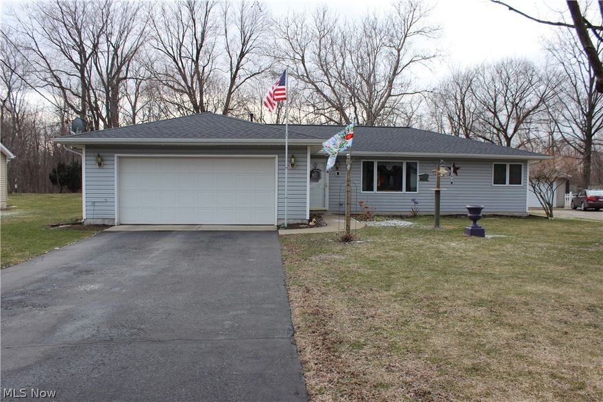 Spacious ranch on quiet street in Painesville Township. Open floor plan with wood flooring and ceramic throughout. 2 large bedrooms and 2 full baths, enclosed sunroom that can be used as an office or den. Roof and Furnace new in 2015. Relax on the spacious deck and enjoy the park like settings of the backyard. Home Warranty is Included!