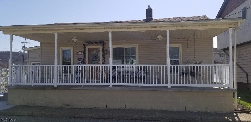 Over the top remodeled home with 2 bedroom garage apartment and detached garage. This home was remodeled as the owners forever home with no expense spared. The home has a custom kitchen with soft close drawers, pull out storage, breakfast bar, stainless steel Frigidaire and Bosch appliances with a custom tile back splash. The main floor laundry room has a Bosch front load washer and dryer. The home has newer heat, air conditioning, breaker box, floor coverings, fiberglass exterior doors, ceiling fans  and paint throughout. The exterior has a large 32'9 x 8'9 covered front porch with vinyl railing and ceiling fans, covered custom back porch with Trex decking and railing, large concrete patio area and nice landscaping. The home has options to create additional bedrooms if needed. There also is a 28' x 17' detached garage. To complete the property there is a separate detached 2 bedroom garage apartment with all separate utilities. This would be the perfect spot for an in-law or any family