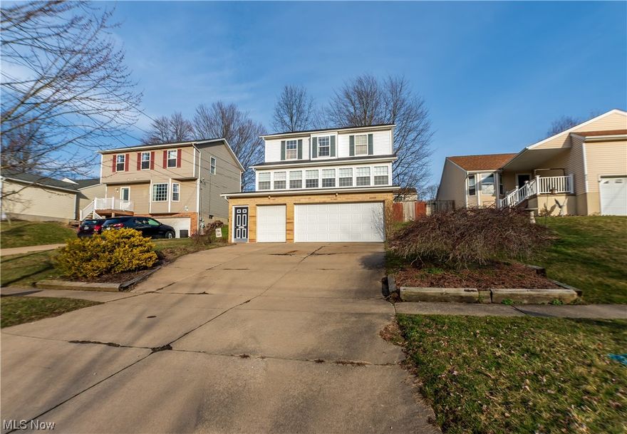 Welcome to this beautiful, well maintained home at 597 Wolf Ave! Located in a quiet and friendly neighborhood near restaurants and shops, as well as multiple parks. As you come up the stairs you will be greeted with a beautiful three season sunroom filled with natural light. Enjoy the open concept floor plan the main level offers with so much room to entertain friends and family. Don’t worry about hiding the laundry—it is conveniently located on the second floor with the three bedrooms and two full baths. You can also find lots of storage space, a fenced in backyard that would make an enjoyable area for entertaining or relaxation, and a 12x12 shed full of additional storage space. Definitely no need to park outside when this home has a 4+ car garage for you to park in! There are so many recent updates including- Roof (2018), Furnace (2020), HWT (2021), Flooring on main level (2021), Master bath flooring (2023), Insulated garage doors (2022), as well as new light fixtures (2021)! All ap