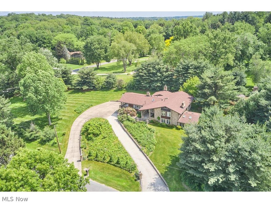 This rare find in Bath Township is a renovator's dream. Perched on a hill with 1.5+ acres in the highly desirable Rolling View/Retreat neighborhood, you have the ideal spot to create your dream home. Come with a big renovation budget, the bones of this house are ready for whatever you can dream up. The 1st floor features the living room w/vaulted, beamed ceiling, stone fireplace & 2 sets of sliders that lead to a covered patio overlooking a large side yard. The kitchen features double ovens and indoor grill. Adjacent to the kitchen is the family room with a wood burner fireplace. A formal dining room, breakfast room, & half bath complete the 1st floor. The 2nd floor features 3 large bedrooms and 2 full baths, including the owner's suite. The finished lower level features a 2nd family room with fireplace. French doors from the family room lead to the sunroom. A slider from the sunroom leads to the backyard. 2 additional bedrooms, a full bath, and the laundry room complete the lower leve