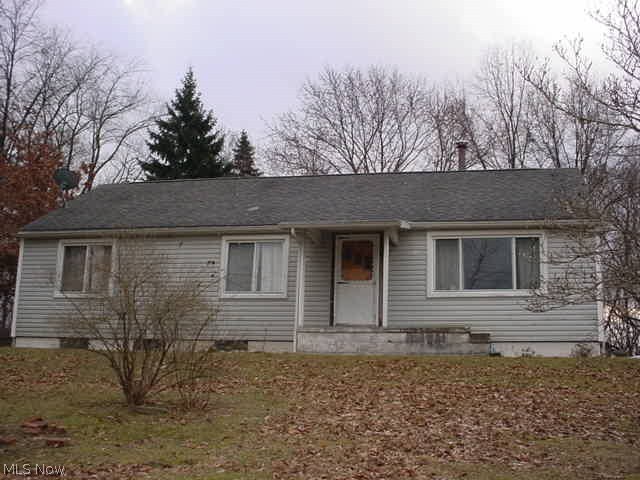 3 bedrooms with open kitchen/dining/living rooms! Hardwood floors! Remodeled full bath and 2nd bath roughed in in the basement, toilet installed! Another room roughed in in basement too! Screened in rear patio! Fenced back yard! Newer kitchen counters! Range, frig, microwave, washer & dryer! Nice bones ready for your finishing touches. House sits on top of hill overlooking baseball fields, 2 parcels. Newer roof!