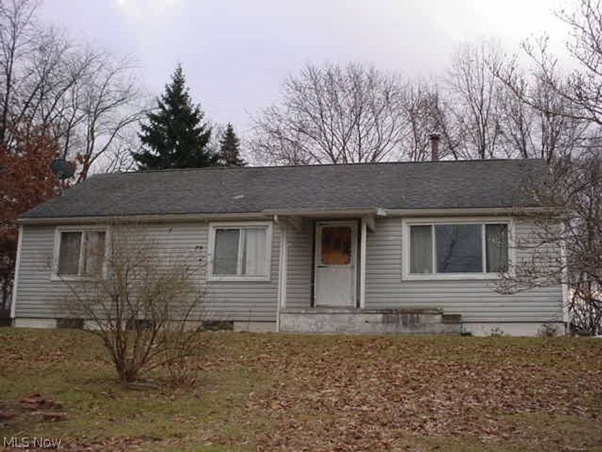 3 bedrooms with open kitchen/dining/living rooms! Hardwood floors! Remodeled full bath and 2nd bath roughed in in the basement, toilet installed! Another room roughed in in basement too! Screened in rear patio! Fenced back yard! Newer kitchen counters! Range, frig, microwave, washer & dryer! Nice bones ready for your finishing touches. House sits on top of hill overlooking baseball fields, 2 parcels. Newer roof!