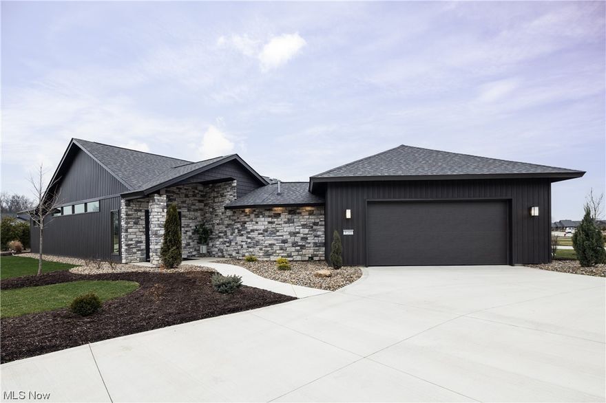 Behold the breathtaking new model cluster home crafted by Bob Schmitt Homes, a beacon of elegance & innovation. This architectural marvel unfolds w/ a cathedral ceiling gracing the grand room, kitchen, dining area & entry, setting the stage for unparalleled luxury. The kitchen, a culinary haven, enchants w/ an island, upgraded cabinet, a wine refrigerator, solid surface countertops, a stylish backsplash, skylight & a walk-in pantry. The master suite, a sanctuary of indulgence, featuring a tile & glass shower & a WIC. A 2nd bedroom boasts a full bath, while the sun & mud rooms add to the allure of this splendid abode. Step into sophistication through the covered front door entry & bask in the serenity of the covered patio adorned w/ skylights. The garage is a masterpiece, complete w/ a 10ft ceiling, OH Garage Interiors flooring, hot & cold water, a floor drain, pegboard, pull-down stairs to overhead flooring & a service door leading to a second patio. Practical features include a sprinkler system, a 2 stage gas furnace w/ a variable-speed blower, a tankless water heater & an oversized driveway. Entertainment & buffet cabinets add a touch of opulence. Nestled in a fully landscaped lot, this home is part of a community that boasts a clubhouse complete w/ a fitness center, an Olympic-size pool & a children's pool. Your dream home journey begins now w/ models welcoming exploration daily from 1:00 - 5:00 pm at 9095 Gatestone Road. Visit today!