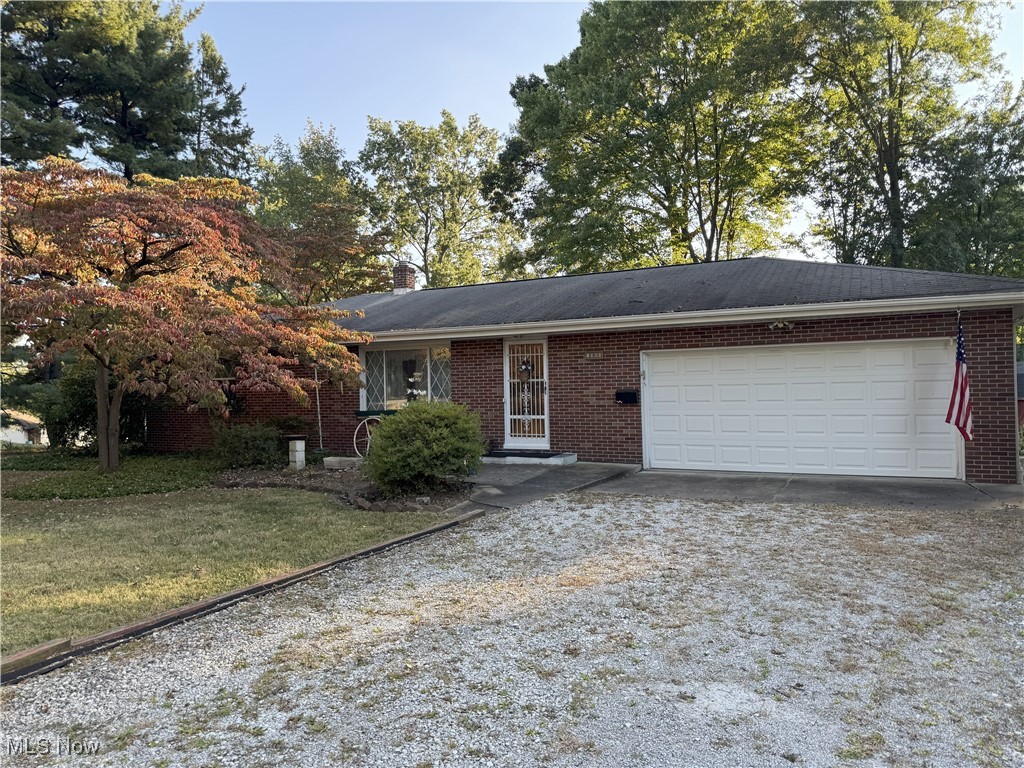 Move in and do your own decorating. 2 Bedroom brick ranch wiht attached 2 car garage on .582 acres. Gorgeous yard with a perfect garden area with raised beds. Eat-in kitchen, living room and all 2 bedrooms have hardwood floors. Full basement with shower and toilet, great for storage or can be finished for additional living space. Country feel with city conveniences. City water and well. Well is used for washing cars and watering the garden. 3 sheds. Furnace in 2017.