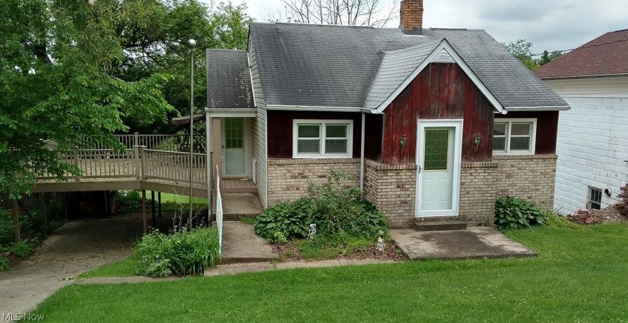 Two bedroom on large lot with finished attic that provides a possible third bedroom. Large deck, paved driveway. Garage is not accessible via car, located under deck. This house needs some TLC, but could be a very nice starter or rental.