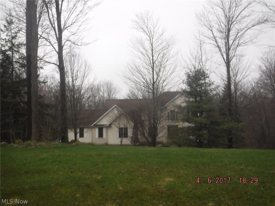 Fabulous, spacious four bedroom newer home with a 3-tier Deck and lower level patio which can be reached from the walk-out basement. This home has a First Floor master suite and a two story great room!  Barn with stable and fences, and an in-ground pool sit on this beautiful acreage.  It just needs your love and affection to be restored! Being sold in as-is condition.  No repairs by seller. All financing accepted.