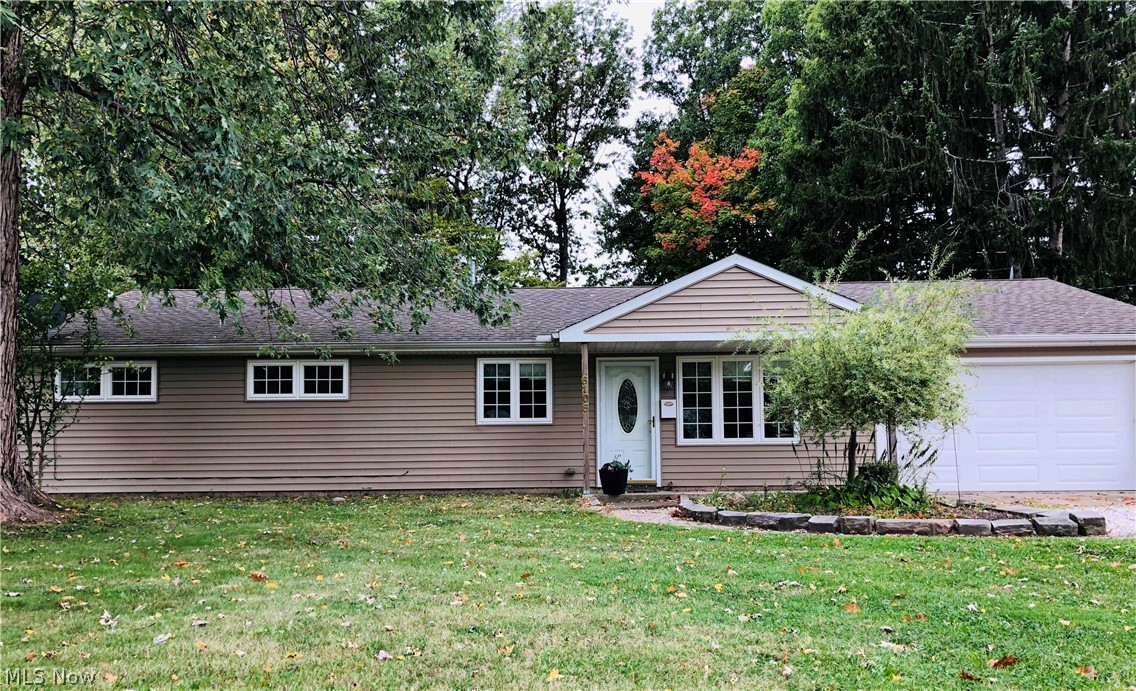 Located close to parks, shopping, dining, entertainment, and with easy highway access, this beautiful ranch has so much to offer! This well-maintained home features a spacious living room and an updated eat-in kitchen with stainless steel appliances that overlooks the large, fenced-in backyard. The three bedrooms boast lots of storage space and the master bedroom has an en-suite half bath. The laundry and utility room, which connect to the half bath, may also serve as a mud room because it is a second entrance to the backyard. In addition, this home also features a bonus room just off the kitchen, which is perfect for entertaining or relaxing. The bonus room has a third entrance to the backyard and patio, as well to the attached two car garage. Don't miss seeing this gorgeous home today!