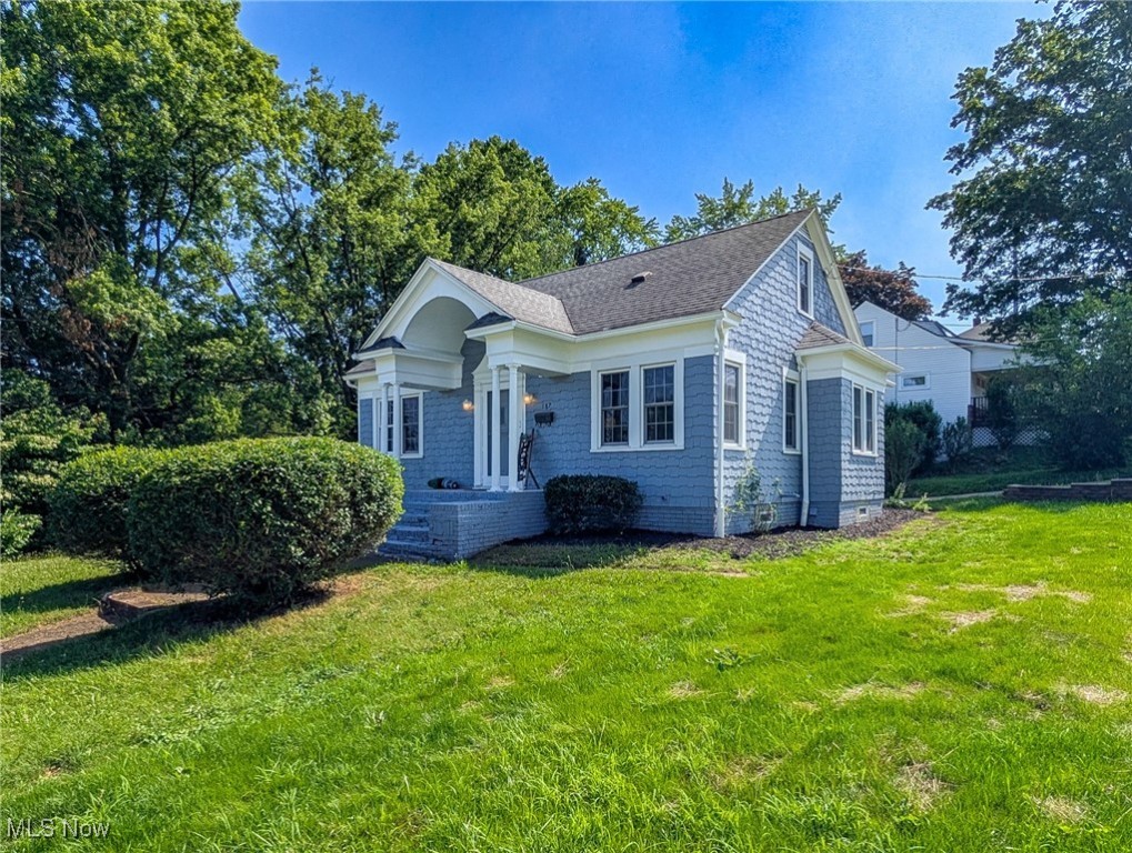 Beautifully updated 4 bedroom, 2 bathroom Bungalow in a historic Barberton neighborhood. EVERYTHING has been renovated and/or updated. Beautiful light filled living room is a great place for family time together or entertaining. A beautiful new electric fireplace sets the tone. Connected seamlessly is the new kitchen, boasting all new cupboards, new granite counters and all new stainless steel appliances. Down the hall you will find a classic and timeless built in and 2 nicely sized bedrooms and a completely renovated full bathroom. Upstairs to the 2nd level are 2 fully updated bedrooms. The lower level is sure to please. Another finished living/family room, a beautiful 1/2 bathroom and a possible 5th bedroom or office space. Separated nicely is the utility laundry room with its new HVAC and HWT. Glass block windows allow plenty of light while providing added security. A nice corner lot with a detached 2 car garage will give you years of pride in home ownership. Updates include ALL NEW HVAC, All NEW Duct work, Updated Electrical Panel, NEW back deck, New drainage and downspouts Repaired and/or replaced all plumbing and drains, NEW main water line from street to the house,