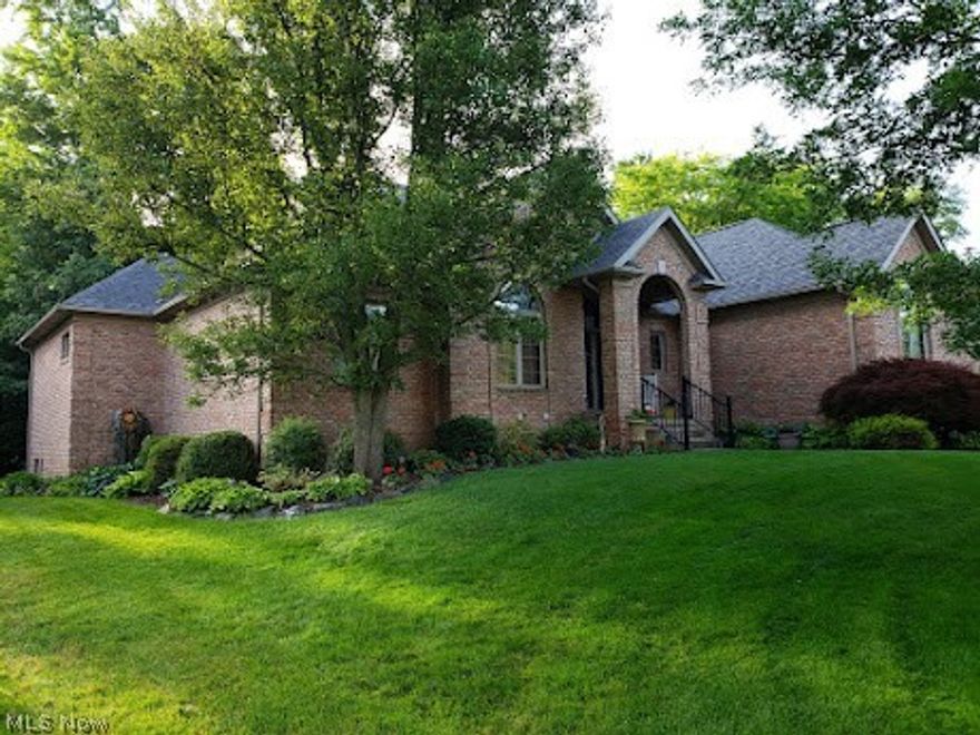 All brick custom ranch located in heart of Green, OH on nearly one acre and with 3600 ft2 finished living space. Beautiful house outside with in-ground pool, gardens, gazebo, woods.  Inside 3 bedrooms, plus large office or 4th bedroom.  Convenient single level living with large eat in kitchen and pantry, laundry, LR with gas fireplace.
Walk out lower level perfect for entertaining with full kitchen and large dining and family room with wood burn fireplace; 4th bedroom with separate entrance.