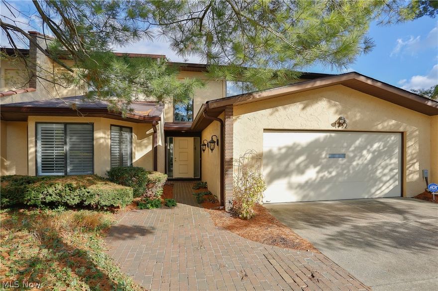 Welcome home to 1732 Brookwood Drive!  Enjoy the comfort of an end unit on a peaceful and wooded lot, with a scenic view of the pond!  This 4,000 square foot, 4 bedroom, 2 1/2 bath condominium has many updates, including newer windows, renovated kitchen with white custom cabinets and a large island, white quartz countertops, stainless steel appliances, newer flooring and carpet in bedrooms and stairway, renovated master bath, new furnace, new AC and much more!  This home features an open floor plan, with bright, natural light throughout.  The ideal location is within walking distance of the Nature Realm Metropark and only a couple miles from Fairlawn and Montrose shopping and restaurants.