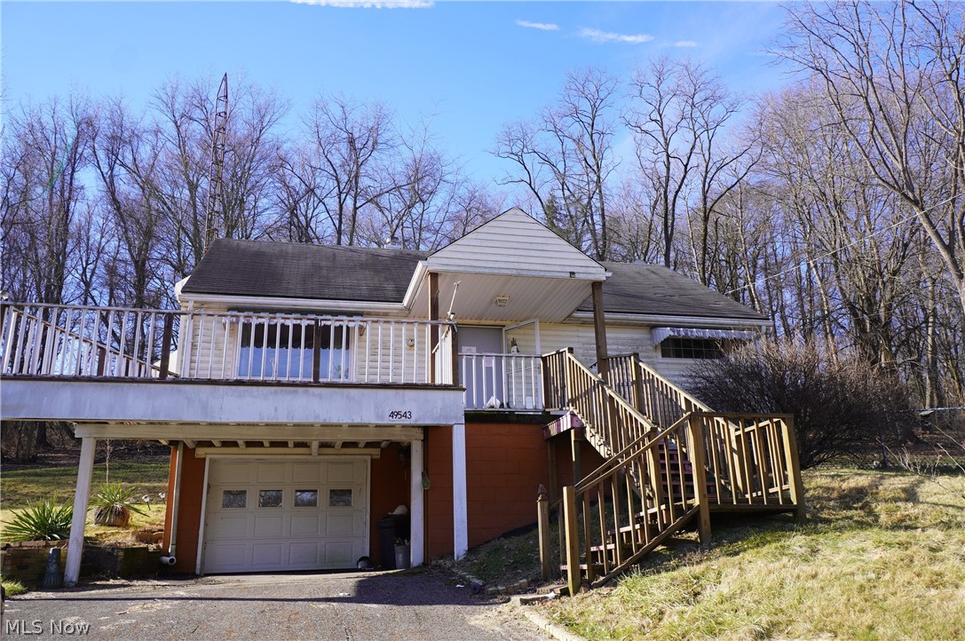 Ranch home sits on 2.37acres with 4 bedrooms, 1 full bath on main level and 1 full bath in the lower level. Front deck, enclosed back porch, and a fenced in area of the yard. Property sold as is. No guarantees. No warranties. Must be pre-approved or show proof of funds.
