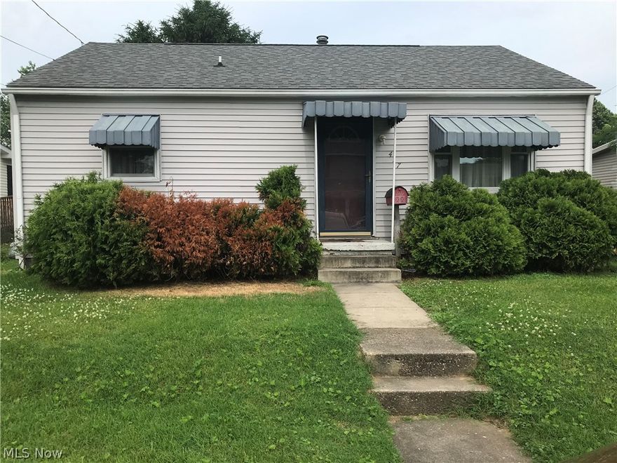 This charming 3 bed, 1 bath Ranch has had many updates in the last 12 years including roof, windows, maniblock system, 200 amp electric, hardwood floors, kitchen and bath.  The large level backyard with alley access is a perfect setting for a new garage.  The house is located half a block from the new elementary school.