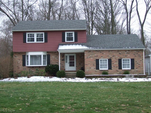 Well-kept 4-Bedroom, 2-1/2 Bath Colonial with open floor plan between eat-in kitchen to fireplaced family room. Kitchen is updated with white cabinets, granite countertops, ceramic flooring and all appliances. Family room has wood-burning fireplace and built-ins with slider to enclosed sun porch which leads to 2-level deck overlooking 1/2 acre leading to city owned woods. Formal living and dining rooms with chair rail and crown molding. Upstairs are 4 bedrooms with updated main bath with deep soaking tub and new vanity. Master bath is also updated with tile shower and new vanity and flooring. First floor includes half bath and entrance to attached 2-car garage. Next to it is second 1+ car garage with heat and electric. Basement has finished area with updated 200 amp electric box. There is also workshop room. Home Warranty included. Updates include roof 2012, furnace/central air/air cleaner 2013, kitchen 2015, master bath 2017.