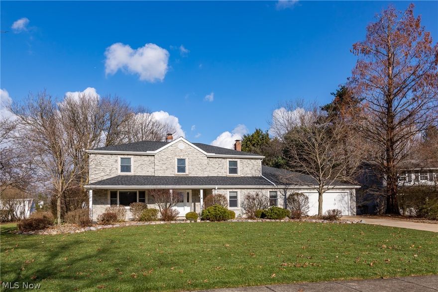 This home is above & beyond any home in the neighborhood.  From the minute you drive up, you will notice the difference.  Beautiful stone front colonial w/ a large front porch sets the tone.  Upon entering, you'll appreciate the spacious rooms throughout.  The kitchen's been nicely updated w/ newer cabinetry, granite counters, ceramic floors, etc.  The heated four seasons sun room can be enjoyed year round. Also on the 1st floor there is a library/study/office w/ built in bookcases.  If you enjoy having a bright place to work out, this home has it on the 1st flr.   The work out room features a rubber floor, mirrors, sky lights & plenty of windows to energize you.  What a great way to start your day.  The large family room features a fireplace & is cozy enough for your immediate family or can hold plenty of sports fans for a super bowl party or any large gathering. And of course, there is a 1st floor laundry room. Upstairs there are 4 generously sized bedrooms.  The master is a nice siz