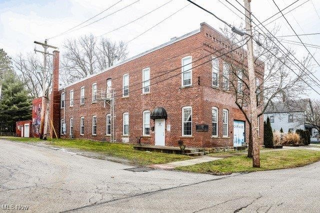 Industrial Elegance meets Contemporary Luxury at 241 Myrtle Street, Ravenna.  A one-of-a-kind Architectural Masterpiece. Discover an extraordinary blend of industrial character and modern sophistication in this expansive 11,000+ square-foot residence-a rare offering that redefines contemporary living in the heart of Ravenna.  Thoughtfully designed with Grand open spaces, exposed architectural details, and soaring ceilings, this stunning property is a true work of art where history and innovation converge.  Unparalleled Living Spaces & Amenities; Boasting three spacious en-suite bedrooms, this home is designed for both luxury and functionality.  The chef's kitchen is a masterpiece in itself, featuring custom cabinetry, top tier appliances, and an expansive layout that seamlessly integrates with the open concept living areas.  The residences' s industrial charm is complemented by warm hard wood floors, striking steel and wooden elements, and abundant natural light filtering through oversized windows.  A Historic location with Modern Convenience.  Located in Ravenna's charming Historic District, this home is just steps from quaint cafe's, local boutiques, and the vibrant energy of downtown.  While preserving its small-town appeal, Ravena offers an effortless commute to both Akron and Cleveland making it ideal for those seeking the perfect balance of serene living and metropolitan access.  Plus, with Kent State University just down the road, this location is perfectly positioned for academics, professionals, and those who appreciate a dynamic yet peaceful lifestyle.  Opportunities like this are exceedingly rare- an architectural gem that blends historic authenticity, modern luxury, and unmatched convenience.  Call to schedule your private showing.