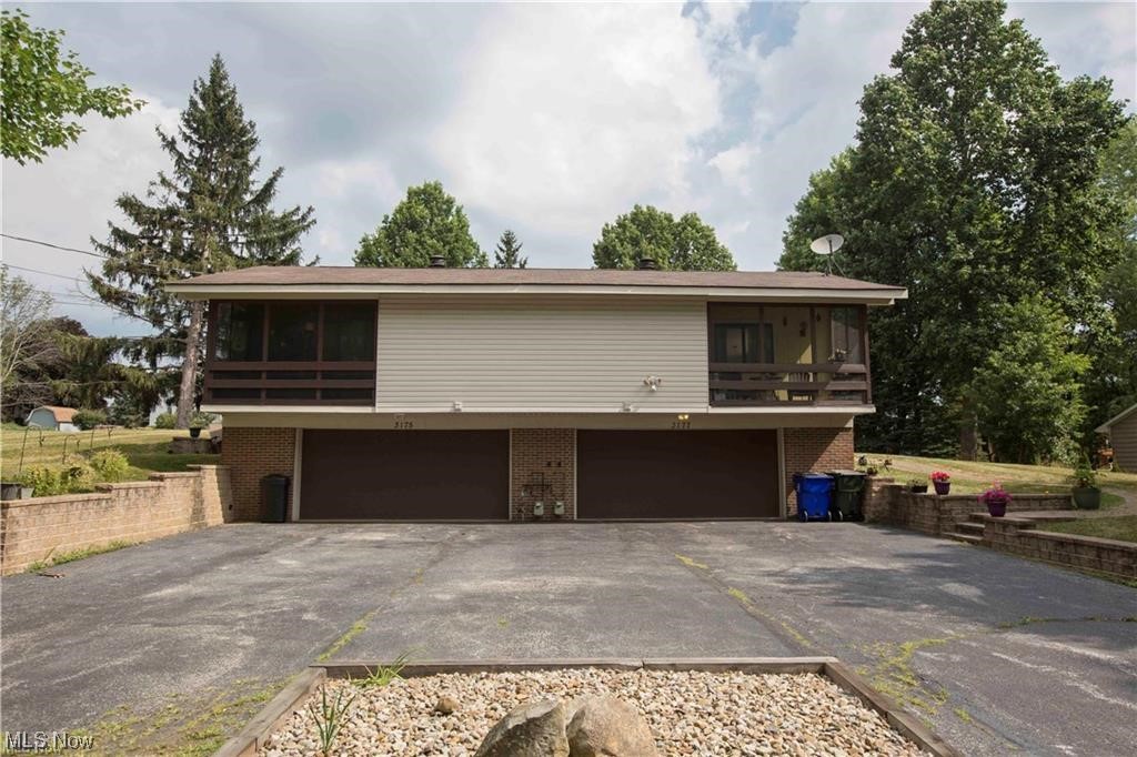 Welcome to this 4 bedroom, 2 bath, 4 car garage duplex located on nearly.75 acres. Enjoy the country setting with single family homes surrounding. Become an instant investor in this turn key property with income generator! Beautiful open floor plan with cathedral ceilings, newer flooring, appliances, bathrooms have been updated and are sure to please. Each unit has 2 car garage, and screen in porches. Enjoy the country setting with many great features.