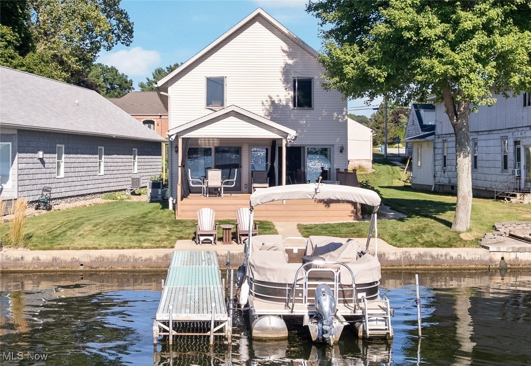 Ready to start checking all the dream list boxes? West facing Main Chain of Portage Lakes with level lot- check! Nearly 2,600 sq.ft. with 5 bedrooms and 2.5 baths- check! New 2.5 garage (2012)- check! Ton of parking enough for up to 10 cars- check! First floor master bedroom with walk-in closet and master bath - check! First floor laundry- check! Open floor plan with wall of windows to enjoy the panoramic sunset lake views- check! Great place to watch the fireworks- check! Composite decking with covered area on lakeside- check! New seawall 2016 with aluminum dock- check! Updated kitchen with granite counters, ample custom cabinetry and stainless steel appliance with breakfast bar- check! This home has been completely remodeled down to the studs between 2011-2013 including new three dimensional roof with 30 year shingles. New well 2016 and new septic 2014. Dual zone heating with one new high efficient furnace and air conditioning in first floor zone 2018. New underground irrigation system 2022. All this within the City of New Franklin. Check all your boxes off and start checking out what lakefront living is all about!