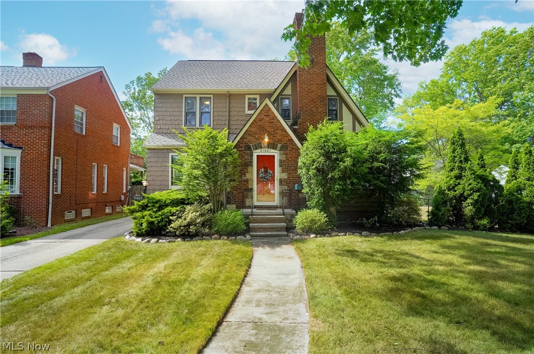 21612 Lake Shore Blvd Euclid, OH 44123 is a beautiful 4 bedroom 1 and a 1/2 bath home with 2 car garage and a RARE DOUBLE LOT just one block to Lake Erie and close to Euclid Park, Noble Beach, Senior Center & Kenneth J. Sims Park. You have been waiting for THIS home! Features everything you need for year around entertaining from the concrete patio in the fenced in backyard to the cozy fireplace in the living room with beautiful period wood, fireplace with gorgeous mantel & surround, large trim, awesome windows, arches, wood floors, built in bookcases & cabinetry to the updated kitchen with granite countertops, prairie style glass cabinet doors, wonderful cabinetry, stainless steel newer refrigerator & dishwasher, gas stove with beautiful natural light as well as lighting throughout. The 1st floor also features a Sunroom to sip a glass of wine at night or coffee in the morning; 1st floor half bath for easy use; Dining Room being used as a wonderful Home Office; multiple doors from the front, side & rear with a gate for the driveway to have a fully fenced rear yard! The 2nd floor features 3 great sized bedrooms, a cedar closet, wooden doors, Full Bathroom that is updated with tile surround, granite vanity top, & subway tile with glass accent & chair rail wainscotting. The Primary Bedroom is huge & easily fits the king size bed, night stand, built-ins, dresser and great location of windows! The Owner is leaving the TV wall mounts for ease of Buyer usage. The 3rd floor has 2 additional rooms with a Guest Bedroom & you could even use it as a Media Room or ADDITIONAL Home Office. The Lower Level Basement accommodates a finished area as a Family Room with Desk Work Area, Built In Bar Area & easily allows for multiple entertainment spots in this home. The basement level also has a large area for storage, Laundry that can be included, workshop & Hobby Area! The roof is in great shape (inspector noted it is only 10 to 15 years old), the home has a one year warranty included!
