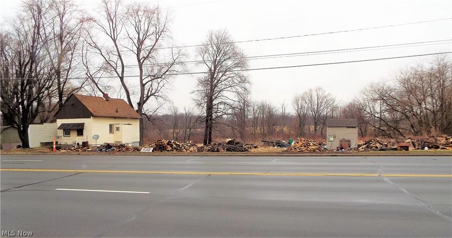 ALL ZONED (C1) Commercial - Lake Township - Uniontown - (1.25) ACRES - Single Family Home on property is connected to PUBLIC WATER and PUBLIC SEWER - Home features: Living Room, Dining Room, Full Bathroom, Kitchen, (2) Bedrooms, full Basement, covered Patio, (2) Car Garage, full Attic over home. Home has plenty of built-in cabinets, closets and storage. There are (2) Large outbuildings / Sheds that stay with the property. UPDATES: Hot Water Tank and 100 AMP Electric. ALL ZONED (C1)