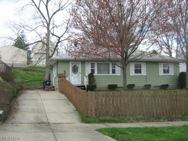 Why rent? Priced below appraised value and much less than rent! Step-saving ranch with beautiful new living room, dining room and hallway carpet (hardwood underneath). New tub surround and freshly painted bathroom. Handsome wooden kitchen cabinetry. Attractive knotty pine paneled rec room with bar (bar stools included). Ready to move right into! Easy access to I-76 - I-77, close to downtown.