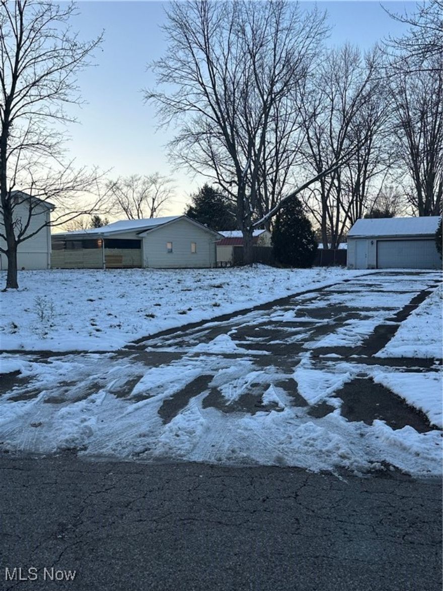 Lot with a garage available in Austintown Twp. House on property is no longer there. Garage remains.