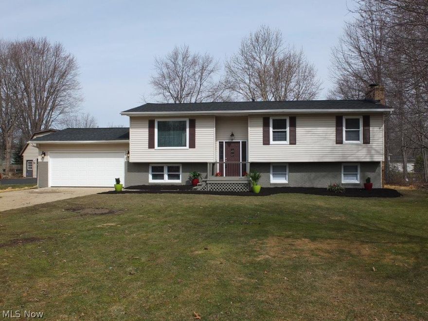 Everything has been updated in this 4 bedroom, 2 full bath home! Brand new roof, furnace, central air, hot water tank, septic, flooring throughout the entire home and completely remodeled kitchen! Large living room is open to the dinette and remodeled kitchen with granite countertop, ceramic tile floor, glass backsplash, new cabinets, pantry, bar with seating for 4 and stainless steel stove, oven, over the range microwave and dishwasher. 3 good sized bedrooms and updated full bath with ceramic tile floor, tiled shower and granite countertop vanity on the main floor. Finished, walkout lower level offers family room with fireplace, recreation room, bedroom 4 and remodeled full bath with ceramic tile floor. 2 car attached garage, deck off the dinette and covered patio too! Everything is new and updated, just move right in!