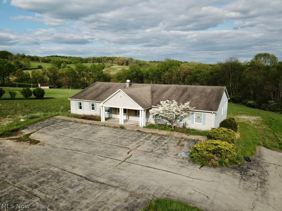 Commercial Building ( formerly a senior care facility) w/ 10 bedroom & 11 baths. Commercial kitchen, laundry area, office space, common area & full basement w/high ceilings for more possibilities. Deck across back of building. Situated on 3+acre lot w/public water. Public sewer is also available at road (buyer to do their diligence to confirm cost/ availability for hook-up). Large paved lot in front & gravel lot in rear. Check out the 3D walk-thru