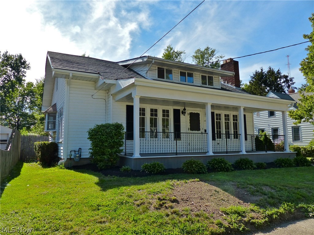 NEW Roofs will be installed on the house and garage as of 8/31/17. Family size 2300 sqft. vinyl sided home with great curb appeal, 29' covered front porch with trex flooring, entertaining size living room with fireplace, shelving and laminate flooring, formal dining with window seat & laminate flooring, newly remodeled white kitchen with appliances, bay window, island & stainless sink, full bath with ceramic flooring and glass enclosed shower/tub, first floor bedroom and first floor office off of the vaulted family room, 3 bedrooms up with cedar closets, plus an extra room for upper study space or exercise, full bath with stall shower, much storage,basement, new 19' deck in 2017, fenced lot, 2 car garage, patio, 7 year old roof, 12 month home warranty. Ready to move right