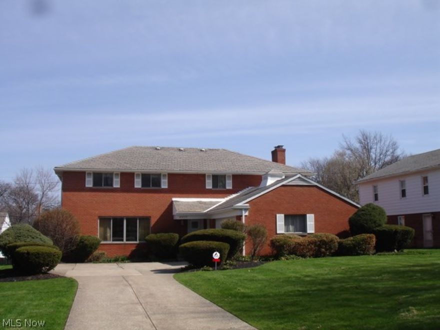 Brick colonial with slate roof in convenient eastern Shaker Hts location with southern exposure. Wonderful floor plan, and lots of custom built-in features. Large Living and Dining Rooms. 23 ft Kitchen has eat-in space, tremendous countertop workspace & cabinet storage. All Kitchen appliances included. Family Room with masonry FP. 1st fl laundry with built-ins. Slate foyer entryway. Huge Master bedroom. 3 additional bedrooms are generous. Bedroom #4 has wood floors. Two tiled full baths on 2nd. Office on second is equipped with builtin shelves and an ideal computer room. Security system. Closets galore. Full unfinished basement, side load 2 car garage. Family Room leads to deck and grille. Rear lot line is fenced.  This well-loved and solid house is a hidden jewel. Priced to sell.