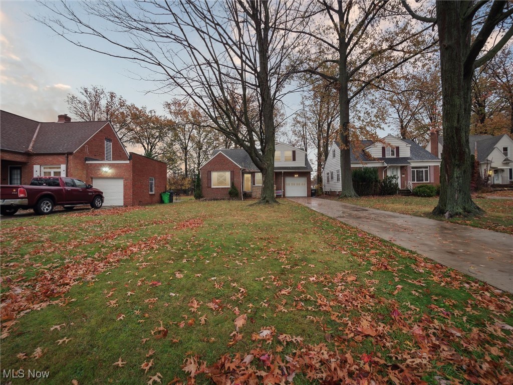 Welcome to this charming and spacious four-bedroom bungalow offering over 2,000 square feet of comfortable living space and fantastic curb appeal. Step inside to find a bright and inviting living room that includes a cozy gas fireplace and a large picture window that fills the space with natural light. The oversized eat-in kitchen features granite countertops, a decorative tile backsplash, modern cabinetry, stainless appliances, a trayed ceiling, and easy access to the huge backyard and deck—perfect for everyday living and entertaining. Just off the front entry, the dining room adds even more versatility—it can also be used as a media room, playroom, or an office. The first-floor primary bedroom connects to an additional bonus room that works beautifully as a home office, extra closet space or a private sitting area, complete with French doors that open to the deck—great for guests or multi-generational living. A full bath, linen closet, and guest storage complete the main level. Upstairs you’ll find three additional bedrooms, including one with built-in drawers and shelving, plus a second full bathroom. The lower level offers a spacious rec room, laundry area, utility room, and plenty of storage. Outside, the deep backyard provides endless options and a multi-level deck to enjoy the warm summer nights. A one-car attached garage adds everyday convenience. This home offers a lot of space and flexibility to meet your needs and it's ideally located close to shopping, restaurants, schools, public transit, and major highways, this home is ready for its next chapter.