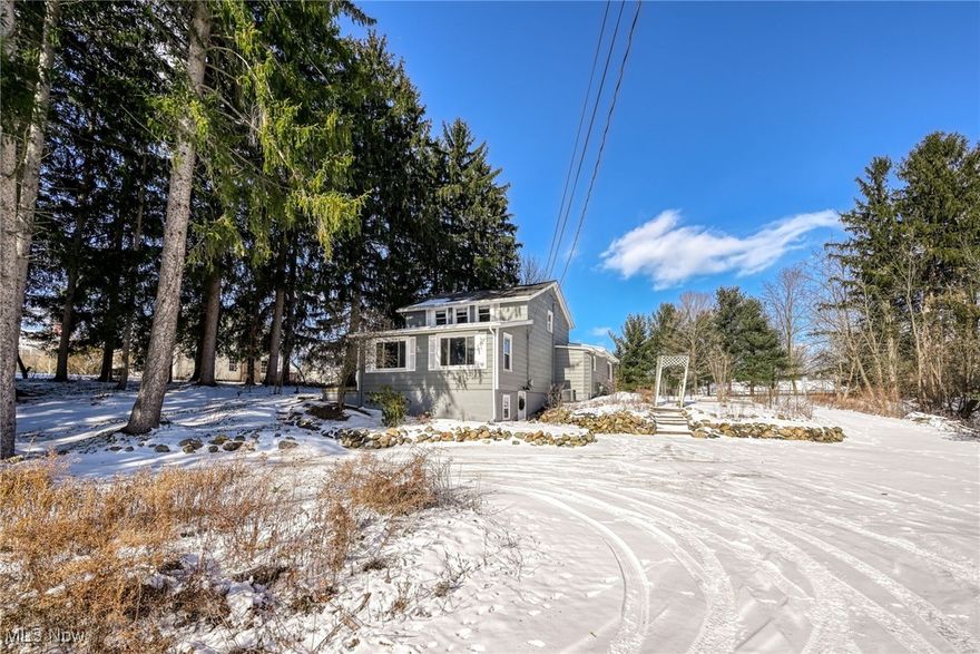 This comfortable, well maintained Aurora century home welcomes you to feel right at home.  It boasts just over 2,000 square feet of finished living space.  The open floor plan on the main level is bright, with an abundance of natural light that gives way to many options for your placement of furniture.  Also, on this level, you will find a spacious kitchen, a large primary bedroom with an expansive walk-in closet and a full bath, with a recently installed step in shower unit.  Upstairs you will find 2 very nicely sized bedrooms and a full bathroom with tub.  Laundry chutes on all levels add character and convenience.  On the lower level, you can access the washer, dryer, and laundry tub in addition to loads of storage space.  On this level there is also a finished office space with newly installed Everstone epoxy flooring, with a transferrable ten year warranty.  The home has had many updates, including a new hot water tank, fresh paint, gutter guards, a newer refrigerator, and the beautiful step in shower.  A complete list of most recent updates will be available. Outside, the large lot is home to two fenced in gardens, many fruit trees, berry bushes, grape vines and wildflower gardens. The towering pines will give you the feel of living in the forest. There is also a large newer shed, for all your yard equipment and outdoor essentials and a kayak rack as a gift to the new owners. The home is conveniently located in the Aurora city school district and is just down the road from Sunny Lake and Spring Hill Parks