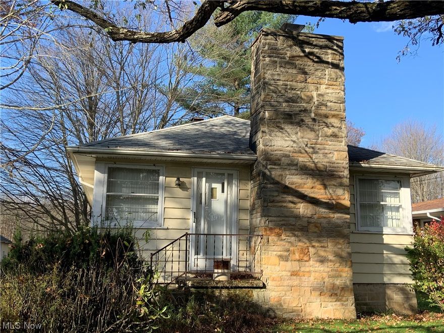 Terrific chance to own over 6 and a half mostly wooded acres with a depth of over 1,400 feet and backing up to another undeveloped 7+ wooded acres for added seclusion and privacy. This opportunity doesn't come around often and also comes with a handsome little 2 bedroom ranch with full basement, formal dining room, eat-in kitchen, two fireplaces, home warranty, and endless possibilities to increase value with little additional investment. Three+ car garage with loft and work area, private yard, and convenient access to highways and shopping. Don't miss out on this unique chance to purchase your own slice of woods in North Royalton.