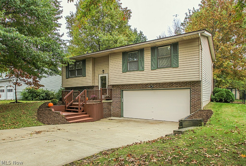 Welcome to this 3 bedroom (possibly 4) home with many updates! Located in cul-de-sac neighborhood near schools and parks! Enjoy neutral decor and large fenced in yard. Many features of this home include 2 tier deck renovated in 2012, updated electrical 2009, new stainless appliances 2014, full bathroom remodel 2011, front steps, new paint and kitchen flooring in 2014. Open floor plan includes a large family room -or- 4th bedroom and full bath with shower downstairs. Separate laundry area with storage, as well as 2 car garage, and shed in backyard. Sold with one year home warranty. Desirable area and convenient location in Kent within 10 minutes of both Route 8 and I-76. What a great value, Call for a visit today!
