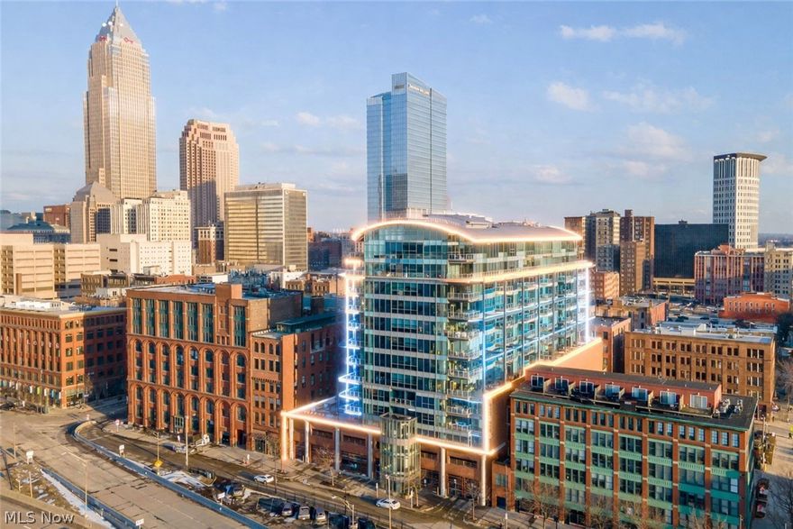 Elevated Living in the Heart of Downtown Cleveland!  Welcome to The Pinnacle, Cleveland's premier address. Experience refined urban living in this exceptional luxury residence located in the Warehouse District - offering both City Views & Lake Erie views!  Designed for those who value sophistication & convenience. This stunning condo blends modern elegance with effortless city access.  Floor-to-ceiling windows flood the space w/ natural light & frame striking views of the Key Tower & the new Sherwin-Williams building. The open-concept layout is perfect for everyday comfort & entertaining. Relax on your private balcony w/ the Browns stadium & Port of Cleveland in the backdrop. Watch cruise ships entering & leaving the harbor all summer & enjoy stunning sunset views. The updated white kitchen features premium finishes: blue-gray granite countertops, modern white tile backsplash, Frigidaire: gallery series appliances, under-cabinet lighting, & an island / breakfast bar w/ a built-in wine fridge. Hardwood oak flooring throughout. Remote activated blinds in the great room! The primary suite offers a private retreat w/ spa-level finishes & generous storage in the walk-in custom closet. Frosted glass French doors lead to the 2nd bedroom suite. The laundry room has a full size stackable washer & dryer & utility sink. HVAC system & hot water tank replaced 2019. Enjoy luxury amenities: 24/7 concierge service, a state-of-the-art gym w/ Lake views, a yoga studio, his/hers saunas, a dog relief station, secure & attached parking, + a huge rooftop terrace w/ grills, seating, and a firepit—the perfect place to watch the fireworks & the airshow from home! Step outside and you’re moments from Cleveland’s finest dining, entertainment, waterfront attractions, and professional sports venues. Secure building access, premium amenities, and low-maintenance living allow you to focus on what matters most. This is more than a condo — it’s a lifestyle move. Schedule your private tour today!