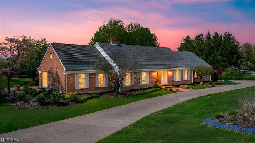 Custom-built brick Cape Cod set on a beautifully landscaped lot with a circular drive and an inviting brick patio terrace—perfect for outdoor entertaining and quiet evenings alike. This one-and-a-half-story residence blends timeless design with thoughtful craftsmanship, offered for the first time.
Step into an impressive open foyer highlighted by a sweeping circular staircase, setting the tone for the home’s character and elegance. The spacious first-floor master suite provides a private retreat, complete with a sitting area ideal for relaxation.
The classic kitchen is fully appliance and showcases a distinctive tile floor and handcrafted tile backsplash, offering both charm and functionality. A first-floor laundry room adds everyday convenience, while the formal dining room is well-suited for hosting gatherings.
Both the formal living room and family room feature fireplaces, creating warm, inviting spaces to unwind. Expansive windows throughout the home capture natural light and offer picturesque views of the surrounding landscape.
The home includes three bedrooms, three full baths, and two half baths, along with an additional finished living area in the basement—perfect for recreation, media, or extended living needs.
A 28' x 28' workshop provides exceptional space for hobbies or storage, complemented by an attached two-car garage. Rich wood flooring runs throughout much of the home, enhancing its warmth and timeless appeal.
A rare opportunity to own a thoughtfully designed, custom home in a beautiful setting—truly a must-see.