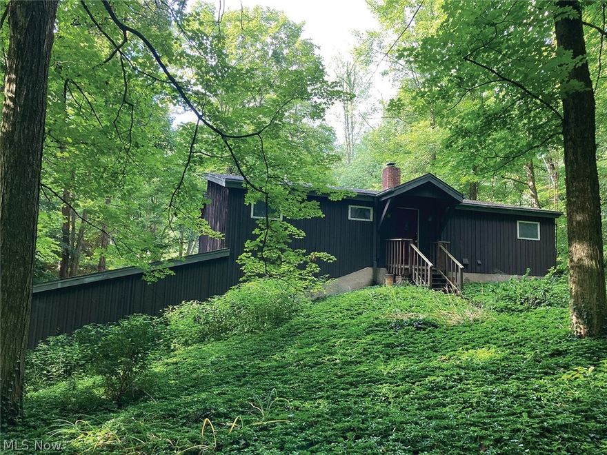 One-Owner Unique One Of A Kind Custom-Built Home – Three Bedrooms – Two-Car Garage With 3.2 Acres – Mostly Wooded - Online Bidding Available On Real Estate - ABSOLUTE AUCTION, all sells to the highest bidder on location. ONLINE BIDDING BEGINS FRIDAY – AUGUST 19, 2022 – 12:00 PM and AUCTION LIVE ON-SITE BIDDING WILL BEGIN MONDAY – AUGUST 22, 2022 – 5:00 PM, REAL ESTATE SELLS AT 5:30 PM. One of a kind custom-built home, 1260 sq. ft., built 1981, three bedrooms, 2 full baths, beautiful southern exposure with loads of natural lighting. Large fully applianced kitchen with center island/breakfast bar, loads of cabinet space, dining area, laundry area, main-level bedroom, and full bath, second ground-level with family room, two bedrooms, one with private balcony, full bath, front foyer, full-length balcony overlooking the lower level. Full basement partially finished with tool room, breaker electric, wood burner. Mudroom area with spiral staircase to all levels. Indoor garden/greenhouse area/