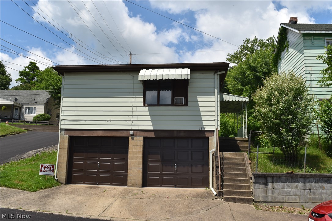 Call All Investors or First Time Home Buyers!! This home is decently priced for a rental or a fixer upper. Cozy ranch home that offers 3 bedrooms and 1 full bath. 2 car garage in basement with newer garage doors. Other updates included newer electric box, hot water tank, and newer roof shingles. Past tenant converted the 3rd bedroom into a first floor laundry room that could easily be converted back into the 3rd bedroom. Conveniently located close to restaurants, gas stations, a park, etc.