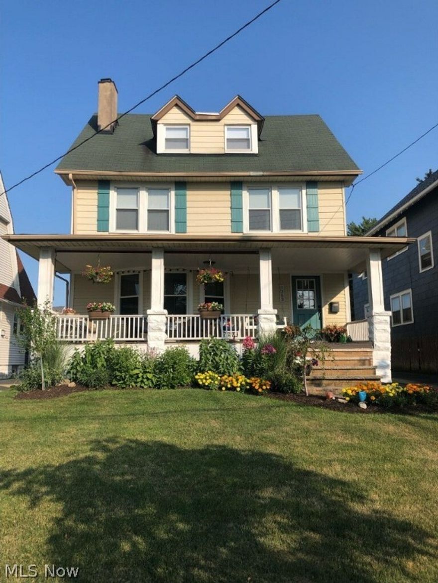 Beautifully remodeled 3 story colonial situated on the west side of Lakewood bordering Rocky River - directly across from Sloane Park. Short walk to Cleveland Metroparks Rocky River Reservation and Emerald Necklace Marina. Gorgeous front porch expands the width of the home and is the perfect place to watch the sunset. Home boasts tall ceilings and an abundance of natural light. Plentiful character and charm from the large picture windows, beautiful hardwood floors, wide baseboards and trim, stunning woodwork, decorative fireplaces, built-ins galore, gorgeous leaded glass and so much more. You will be impressed with the generous room sizes. Spacious living room opens to large formal dining room. Adjacent to the dining room, you will find an additional living space and the expansive, updated eat-in kitchen featuring modern cabinetry, tiled backsplash, quartz countertops and additional prep sink. Convenient powder room on main floor for your guests. Upstairs you will find 4 bedrooms that