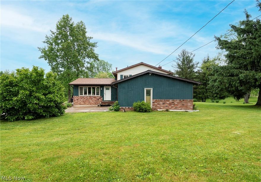 Welcome to 2111 Meloy Road! Sitting on a .7 acre peaceful country lot, this three bedroom, two bathroom split level home boasts an open floor plan, vaulted ceilings, an oversized backyard and more! The main level includes the living room, dining room, and 2016 renovated kitchen with beautiful white countertops, custom cabinetry and French doors giving access to the deck and extended backyard. Your open floor plan main level provides a spacious feel with vaulted ceilings and gorgeous laminate flooring. You will find the three bedrooms and a full bath on the upper level. The lower level includes a family room with a cozy brick wood burner, full bath, utility room, and access to your 2 car garage. Laundry hookups in lower level utility room as well as in the basement. New updates include: electrical panel, refrigerator, and garage siding on road side. Main water line leading from the private well to the house has been replaced (2022) and has a 2 year warranty  Roof and gutters 2019. Basem